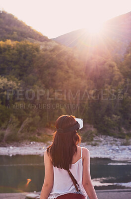 Buy stock photo Hiking, mountain and virtual reality with woman in nature for metaverse adventure, journey or travel. Back, earth and forest with tourist person in VR headset for holiday or vacation user experience