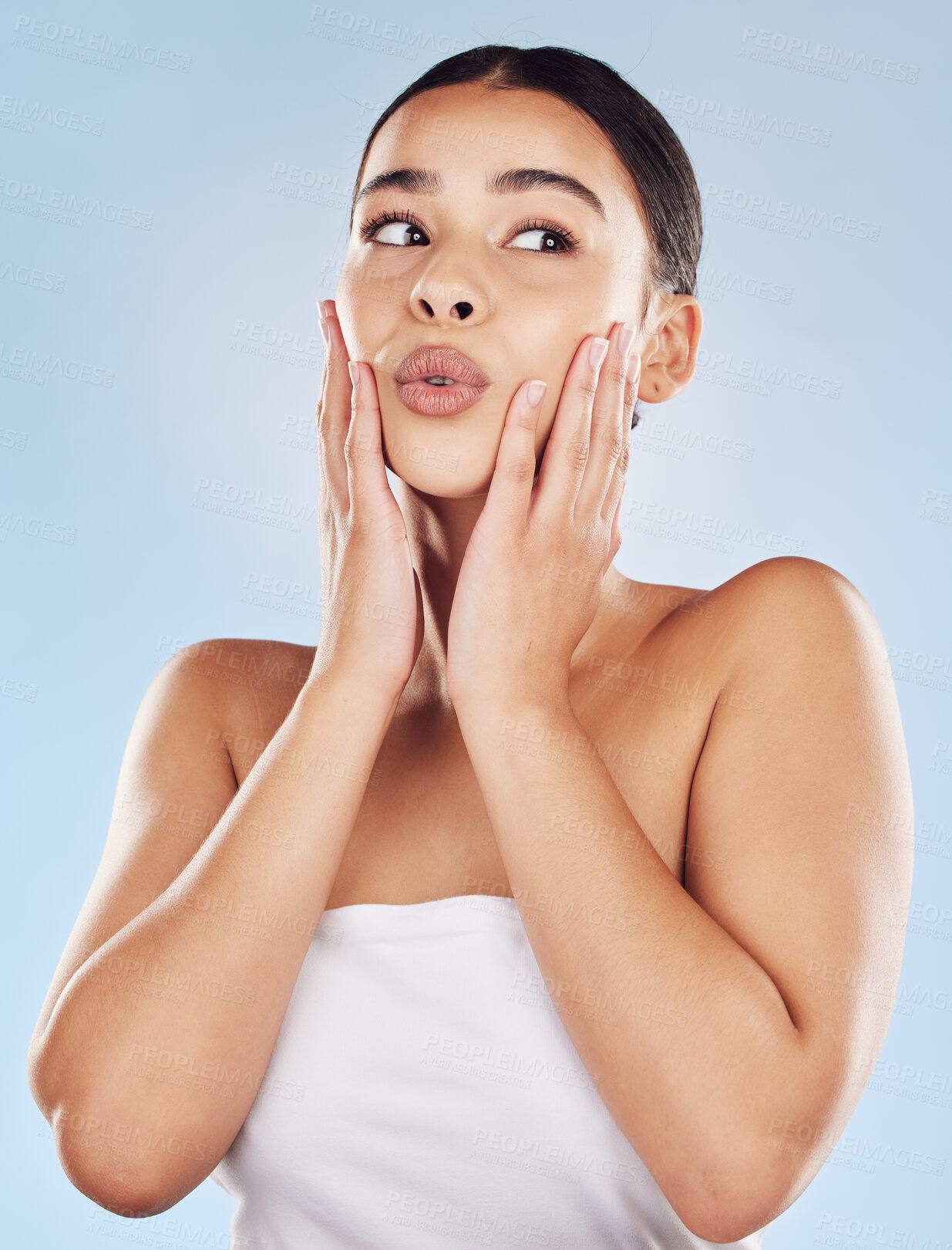 Buy stock photo Woman, thinking and touch in studio for skincare, beauty and cosmetic with healthy skin, lips and vision. Model, idea and hands on blue background for dermatology, aesthetic and facial transformation