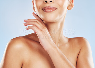 Buy stock photo Closeup, skincare and body of girl in studio for beauty and treatment for natural glow, shine or wellness. Relax, touching and woman with grooming routine for cosmetics or health by blue background