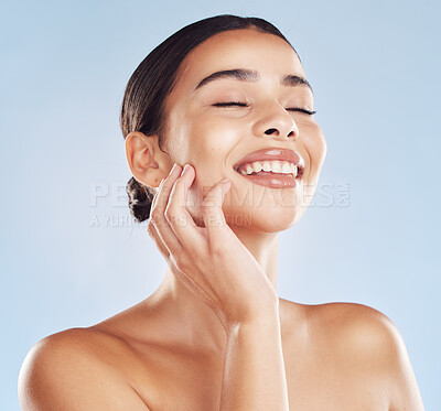 Buy stock photo Happy woman, touch and beauty routine in studio, skincare and facial treatment results on blue background. Female person, confident cosmetics and dermatology for skin tone, transformation and pamper