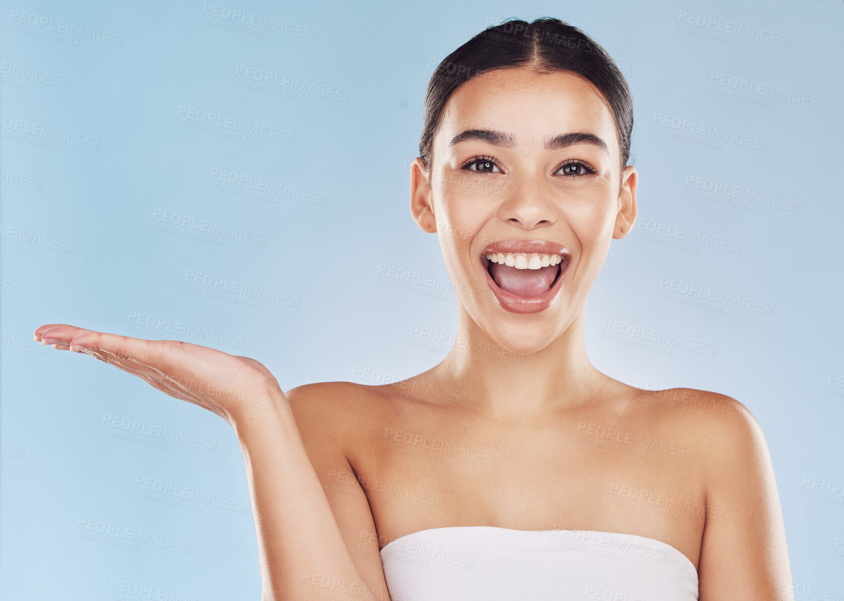 Buy stock photo Mockup, palm or happy woman in portrait for beauty, advertising and announcement space. Promotion deal, studio and girl with hand open for cosmetics offer, collagen or skincare by blue background