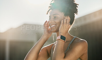 Buy stock photo Fitness, music and black woman doing exercise in city with earphones, smile and ready for training. Workout, running and young female athlete doing sports in town listening to track, audio and radio