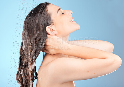 Buy stock photo Hair care, woman and shower in water, skincare and routine for natural beauty with blue studio background. Young female, healthy girl or lady clean head in morning, hygiene or confident to relax