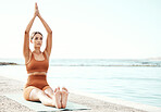 Fitness, yoga and zen, woman at beach stretching for meditation and training in nature for healthy lifestyle. Health, wellness and workout for girl at ocean, pilates exercise for balance at sea water