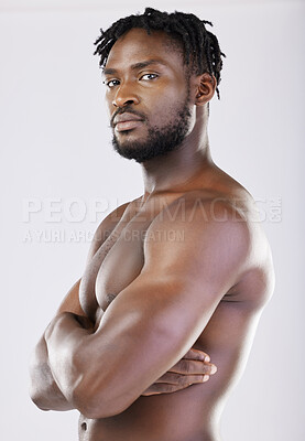 Buy stock photo Confident, muscular and portrait of a black man with arms crossed isolated on a grey studio background. Fitness, health and African athlete with muscle, power and bodybuilding body on a backdrop