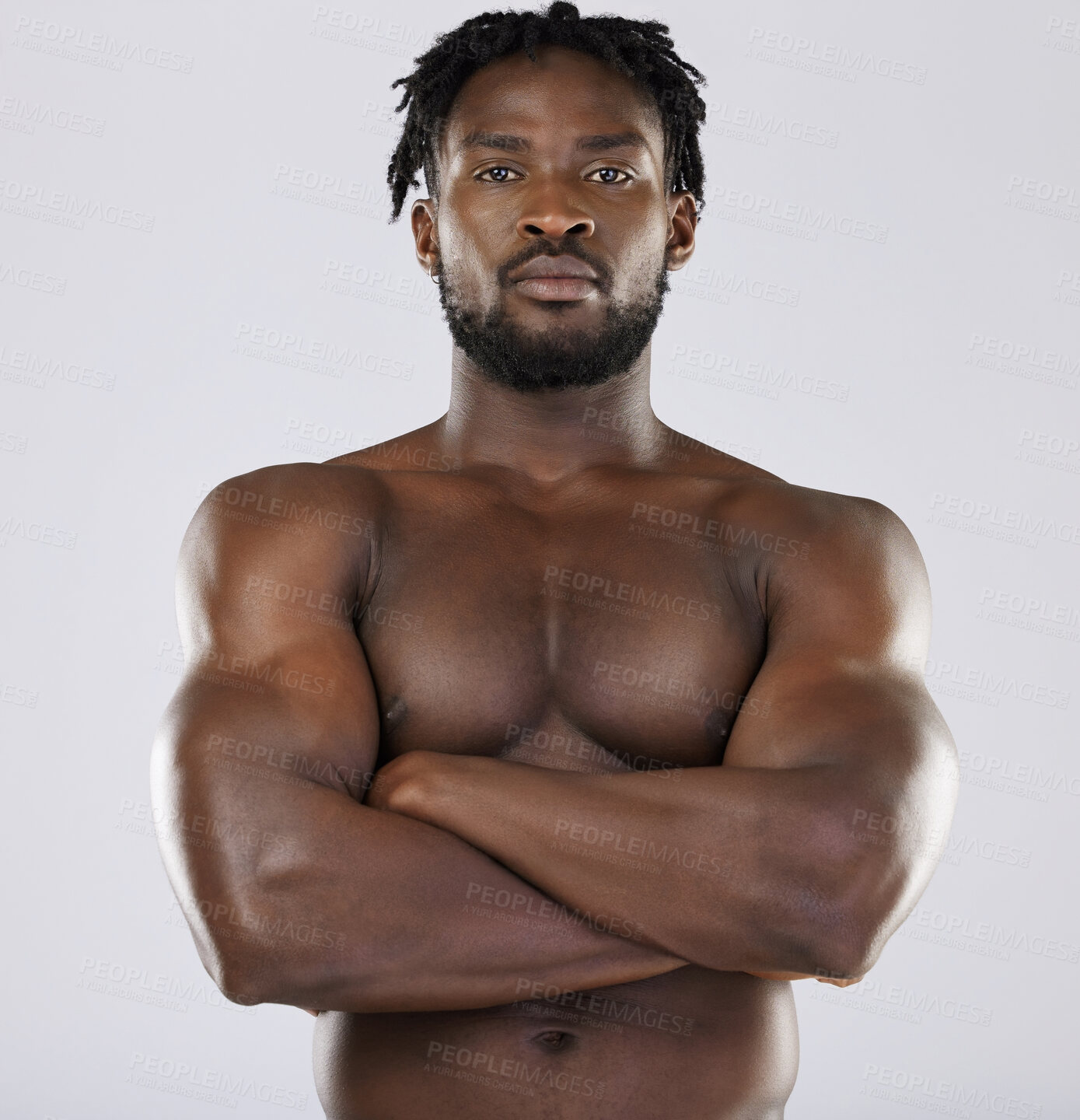 Buy stock photo Muscle, fitness and sexy black man portrait in studio for strong body and power. Health and wellness of a confident male bodybuilder person with arms crossed after exercise, workout and training