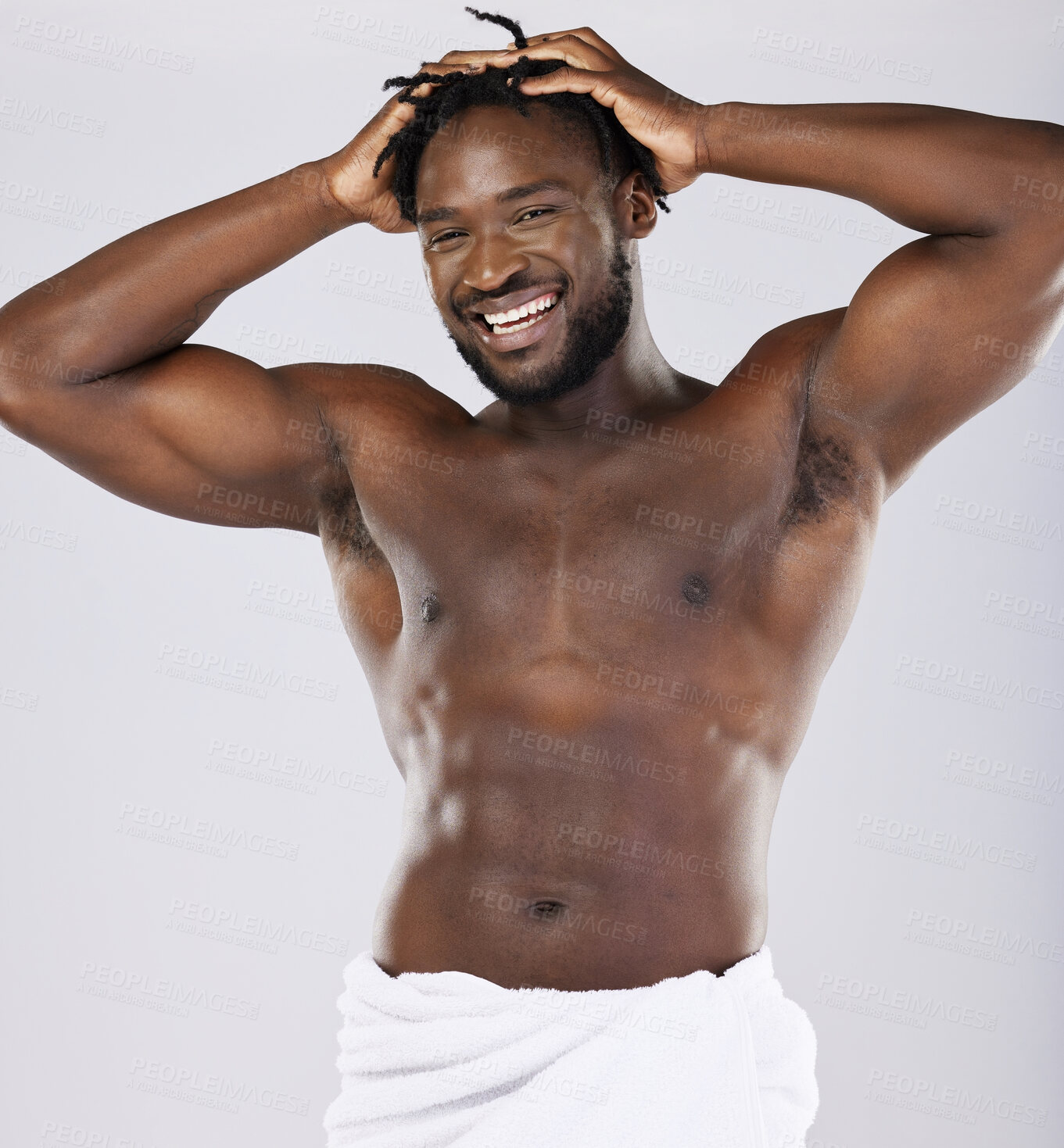 Buy stock photo Black man in towel and skin in portrait, shower and hygiene, grooming and beauty isolated on studio background. Smile, muscle and abs, strong and skincare glow, body care with natural cosmetics