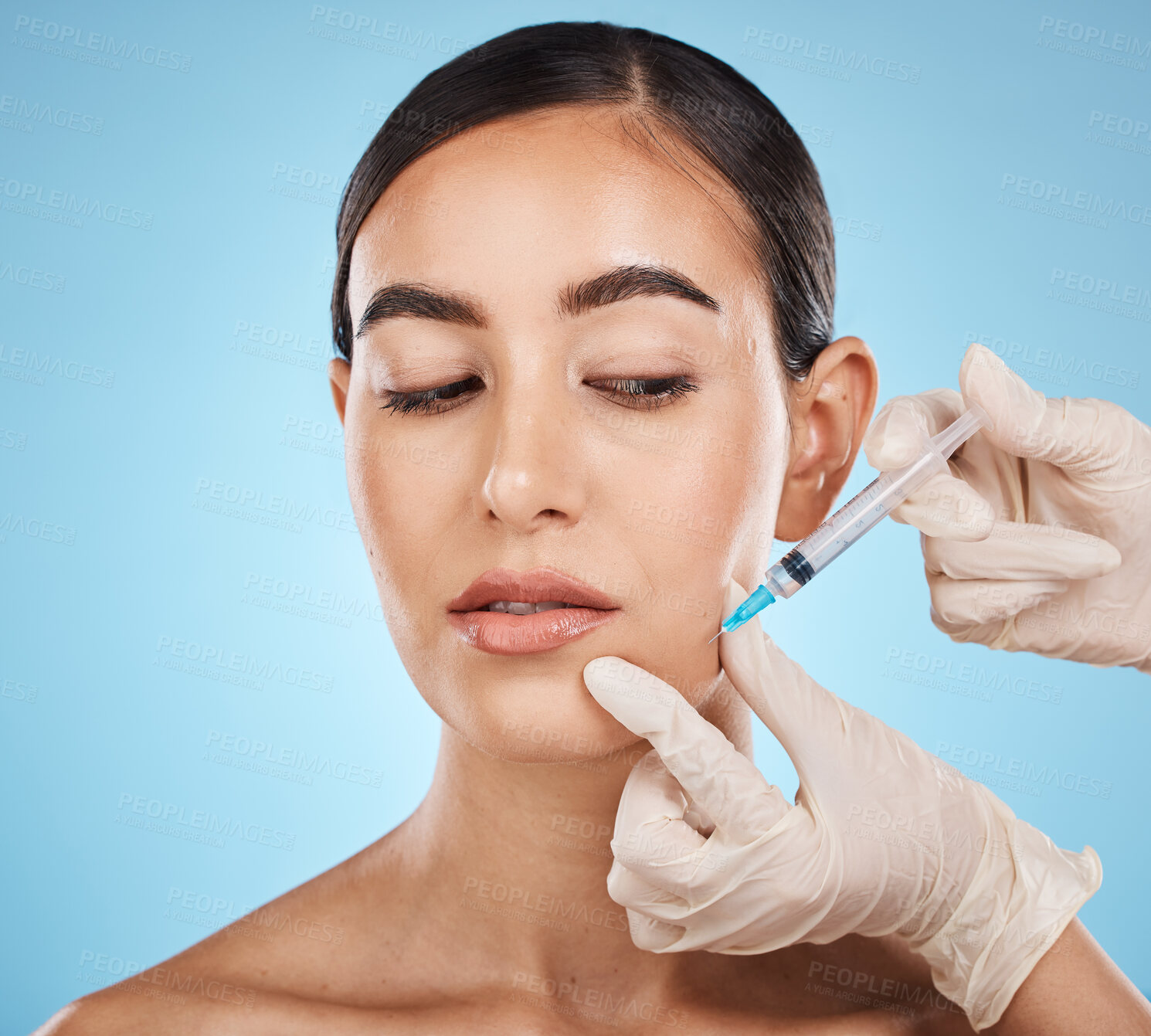 Buy stock photo Needle, woman and plastic surgery for skincare, collagen or beauty clinic in studio. Derma cosmetics, face injection and aesthetic filler for body transformation, change and makeup on blue background