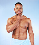 Smile, shower towel and portrait of a black man with fitness happiness from bodybuilder muscle. Cleaning, skincare and wellness after workout and exercise with isolated, studio and blue background