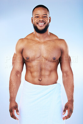 Buy stock photo African man, shower and towel in studio portrait with smile, wellness and start to morning by blue background. Young guy, cleaning body and skincare for happiness, health and self care by backdrop