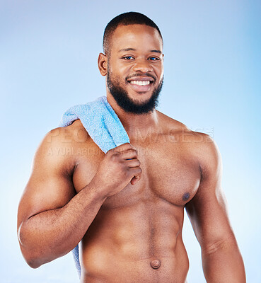 Buy stock photo Towel, shower and skincare portrait of a black man with happiness from bodybuilder muscle. Cleaning, self care and wellness from gym workout and exercise with isolated, studio and blue background