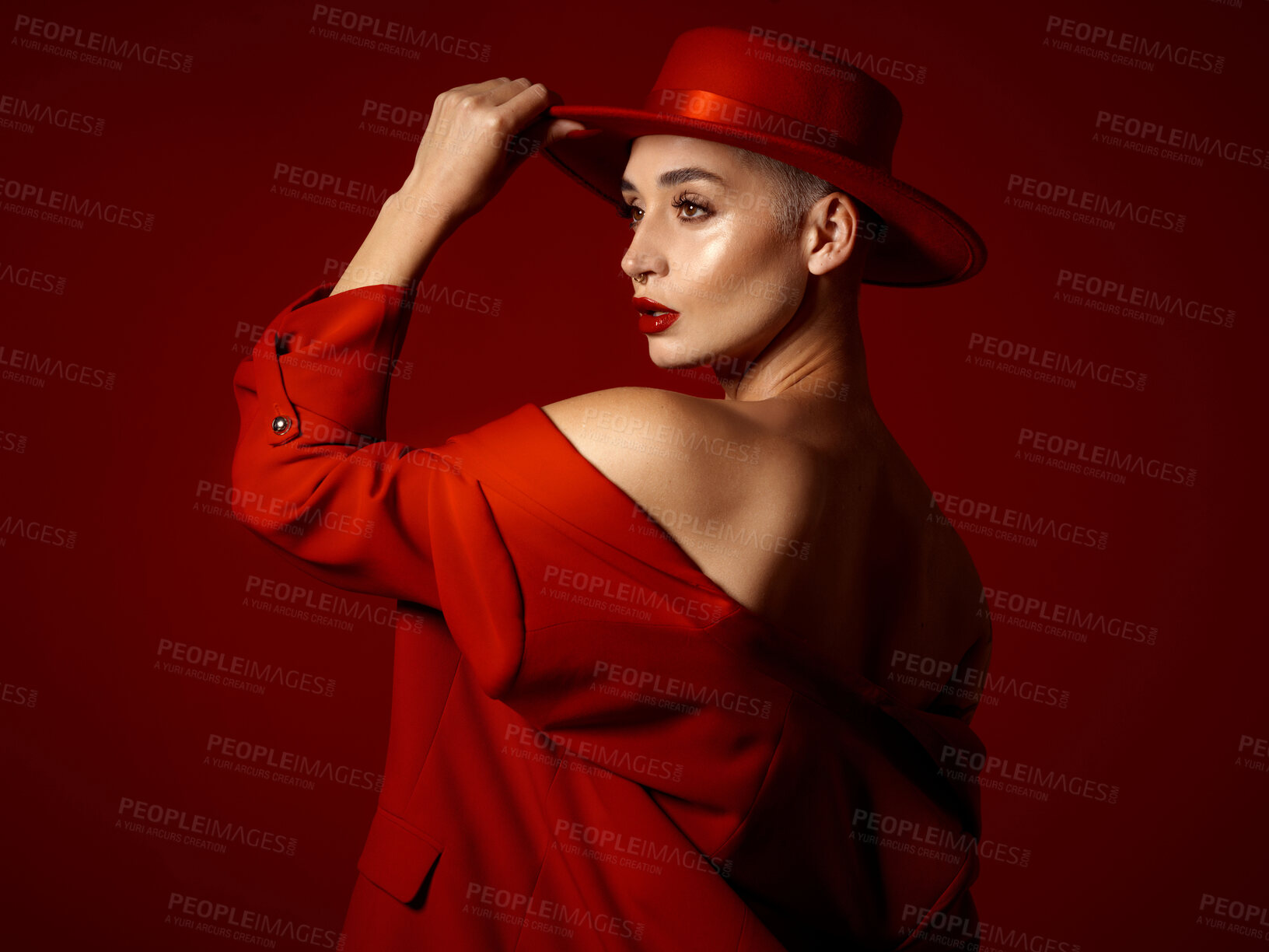 Buy stock photo Back, vision and fashion with a woman on a red studio background for elegant or trendy style. Future, art and beauty with a young female model thinking while looking edgy or classy in a unique suit