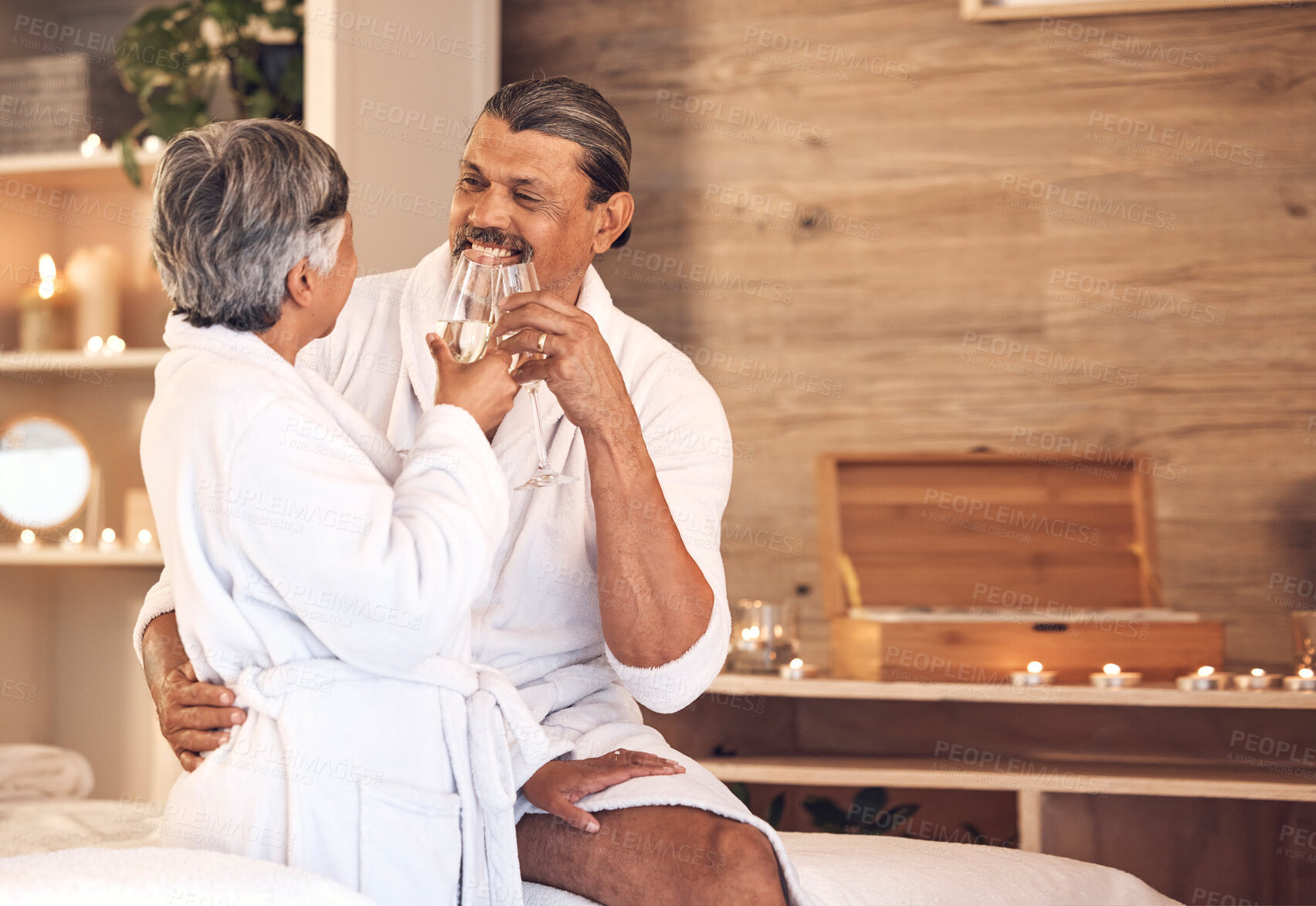 Buy stock photo Anniversary, spa and senior couple with love, celebration and bonding with champagne, marriage and romantic retreat. Mature woman, old man and relax with alcohol glass, relationship and happiness