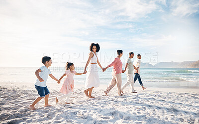 Buy stock photo Big family, holding hands and walking at the beach for travel, vacation and adventure in nature. Love, freedom and children with parents and grandparent at sea for fun, journey and bond ocean holiday