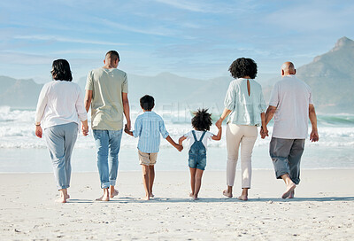 Buy stock photo Back, beach and family holding hands, vacation and summer break with bonding, ocean and travel. People, grandparents and mother with father, children and love with seaside holiday, care and adventure