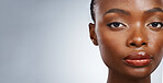 Portrait of black woman, natural beauty or mockup space for wellness in studio with cosmetics or glow. Dermatology, face or confident African girl model with skincare results on white background