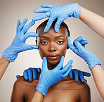 Portrait, hands and plastic surgery for change with a black woman patient in studio on a gray background for cosmetics. Face, beauty transformation and a young model getting ready for derma treatment