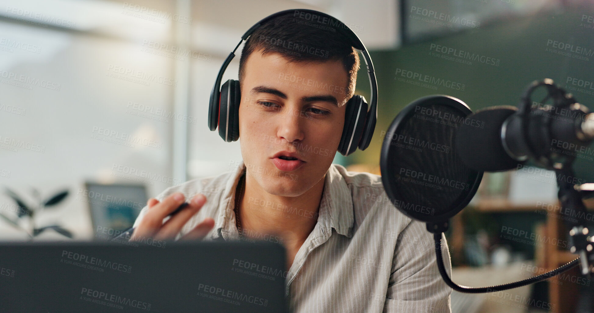 Buy stock photo Podcast microphone, headphones and man talking for broadcast with audio recording and virtual discussion for online talk show. Gen z guy, home studio and radio presenter with speaking for news update