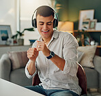 Happy, dance and man with music in headphones for online radio, subscription or listening to sound. Home, male person and technology with smile on chair for audio, streaming service and entertainment