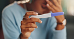 Hands, stress and woman with pregnancy test in home for infertility, bad news or ovulation planning. Sad, upset and closeup of female person reading negative medical information on maternity stick.