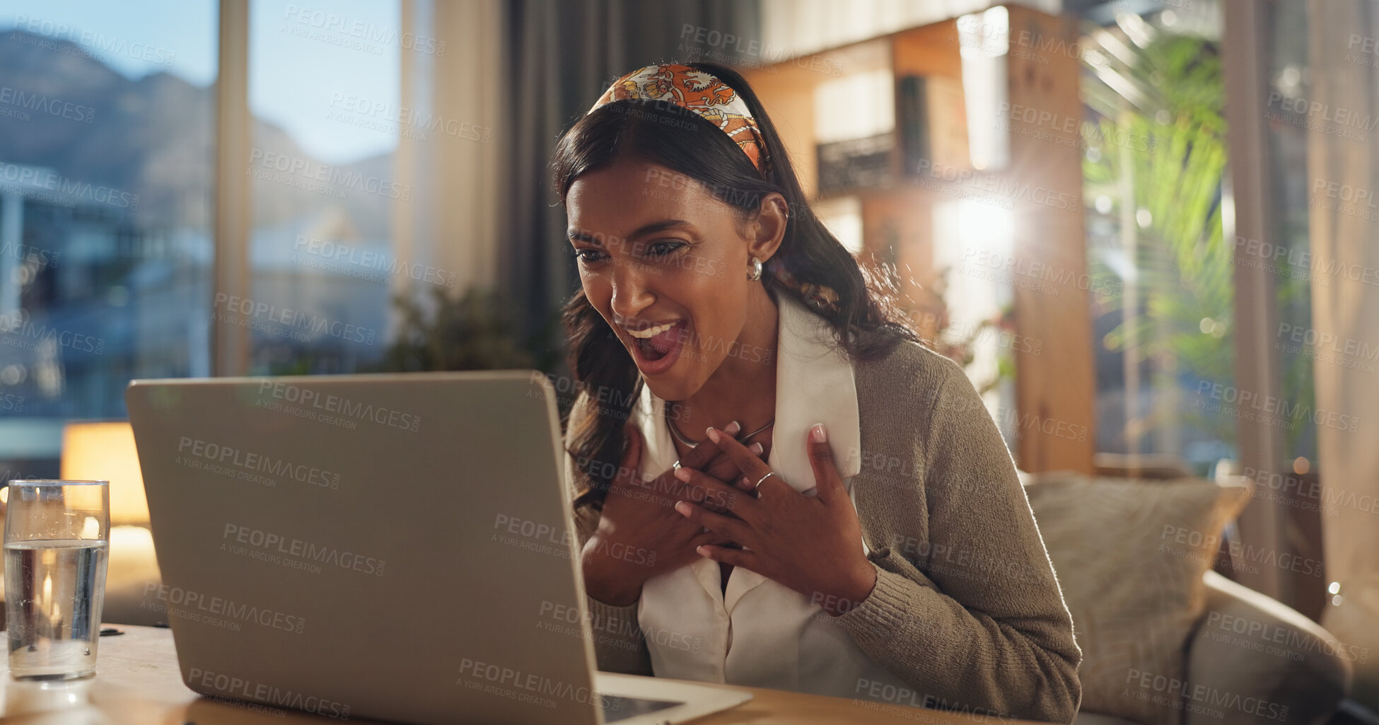 Buy stock photo Employee, Indian woman and excited with laptop in home office for good news, bonus and job promotion. Female person, smile and happy at night with email for career opportunity and interview success