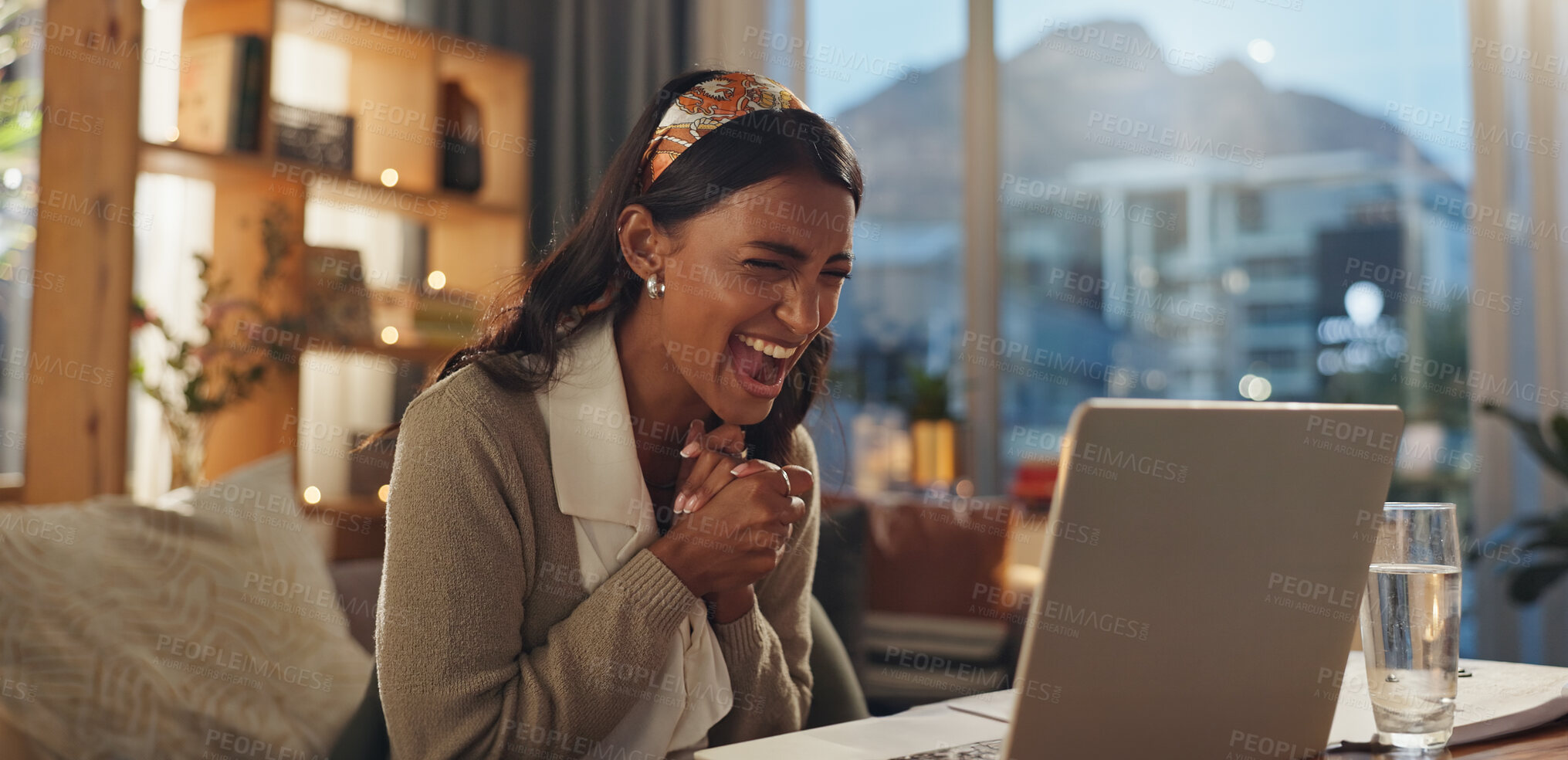 Buy stock photo  Employee, Indian woman and happy with laptop in house office for good news, bonus and job promotion. Female person, smile and excited at night with email for career opportunity and interview success