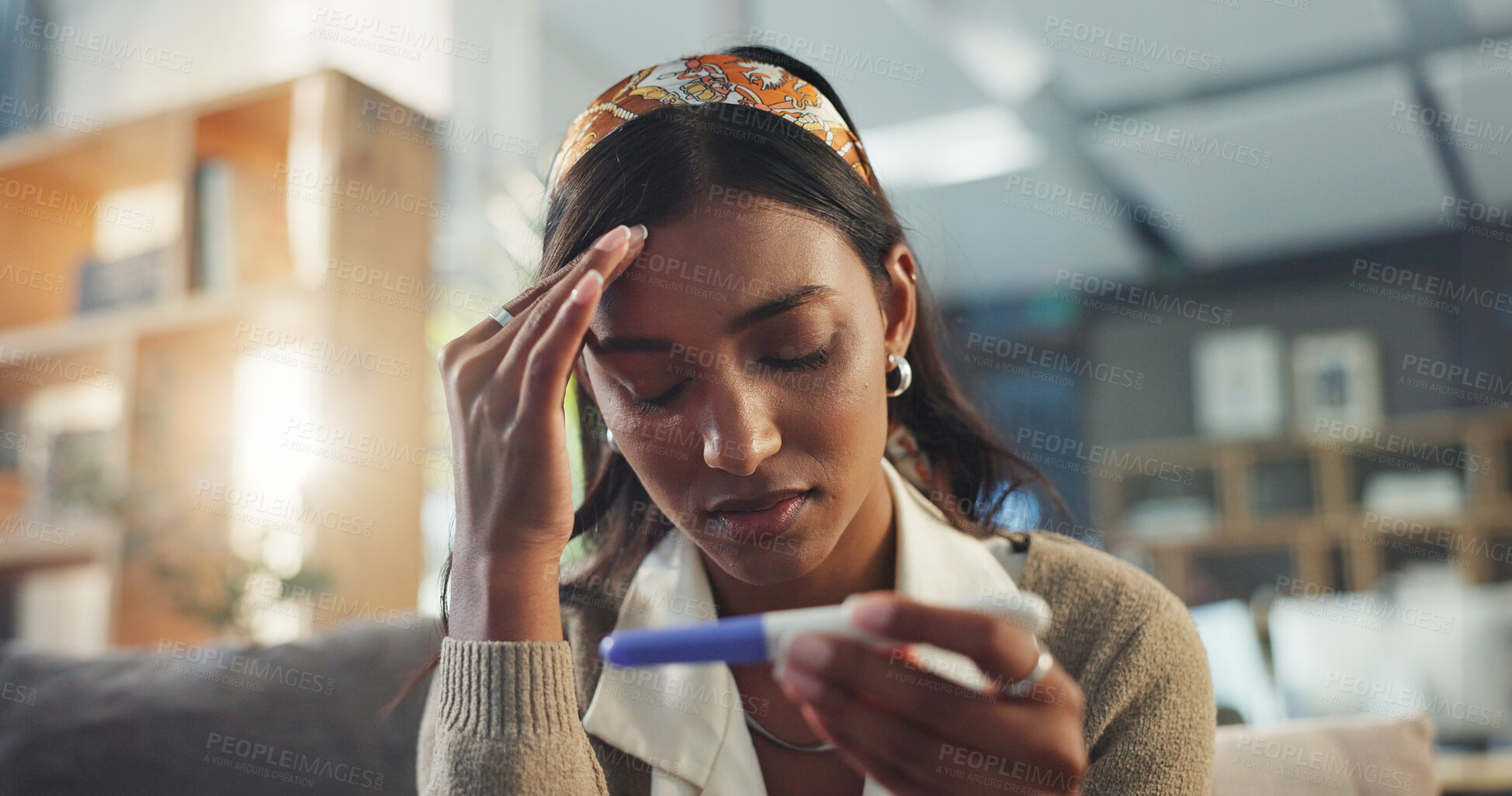 Buy stock photo Girl, home and sad with pregnancy test on sofa for negative results on ovulation stick, unhappy and fertility for motherhood. Woman, emotional and disappointed on couch for trying to conceive and news.