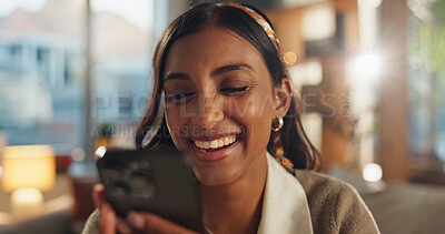 Buy stock photo Phone, laugh and face of woman in home for social media, funny story and online gossip in living room. Gen z girl, happy and mobile on internet for meme, chat and streaming video for humor on weekend