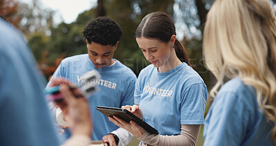 Buy stock photo Tablet, volunteer and people in park for charity event, community service and teamwork. Volunteering, ngo group and men and women on digital tech for social media, website and online inventory