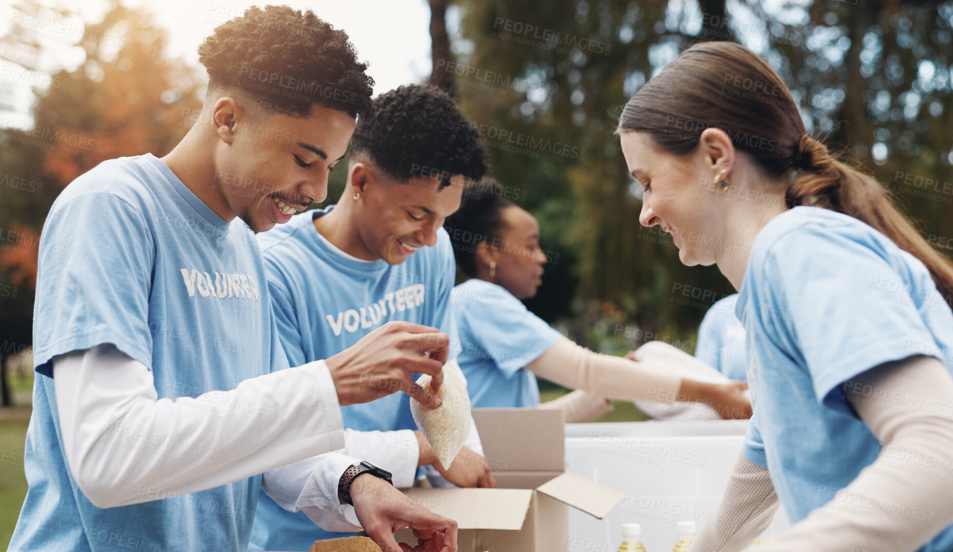 Buy stock photo Donation, volunteer and team of people in park working together at ngo for sustainable green project. Solidarity, men and women at table with boxes, community care and social responsibility in nature