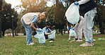 Cleaning, volunteer and people in park with trash collection for sustainability, plastic and ngo project. Solidarity, garbage and hand with bag for charity, community care and social responsibility