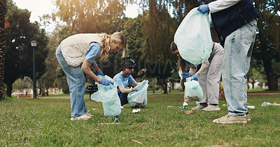 Buy stock photo Cleaning, volunteer and people in park with trash collection for sustainability, plastic and ngo project. Solidarity, garbage and hand with bag for charity, community care and social responsibility