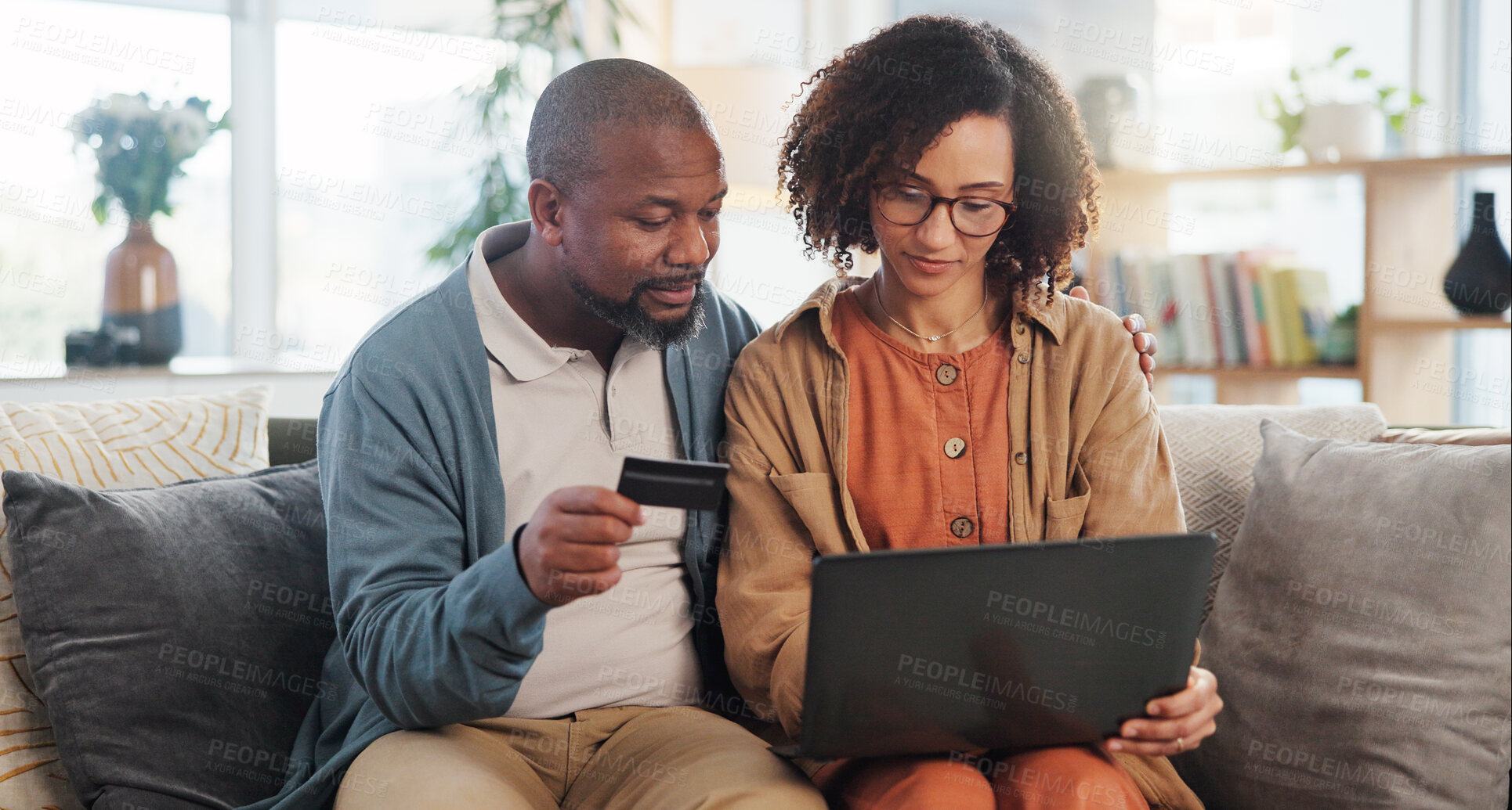 Buy stock photo Mature couple, banking and laptop with credit card for online shopping, discount and sale. African people, ecommerce and typing on fintech app in home with rewards, voucher code and savings password