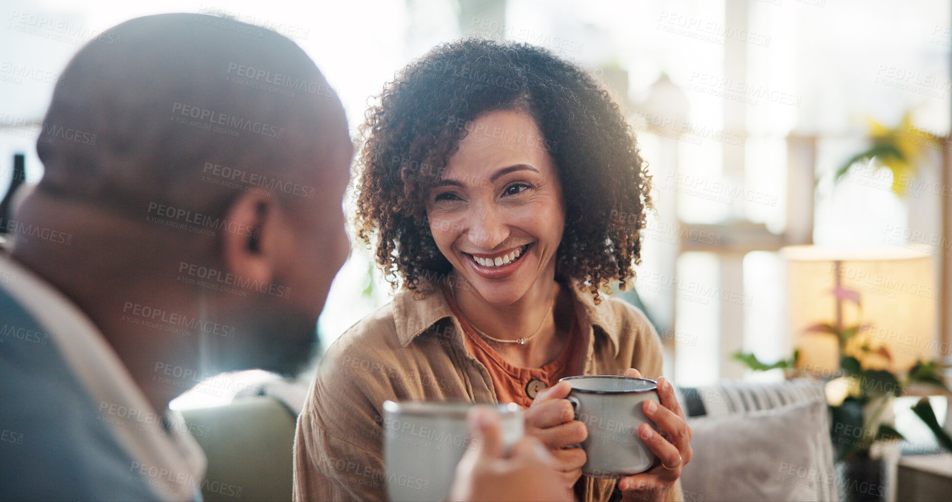 Buy stock photo Smile, love and coffee with mature couple on sofa for bonding, marriage and romance. Happiness, calm and health with people drinking in living room of home for tea, communication and comfort together