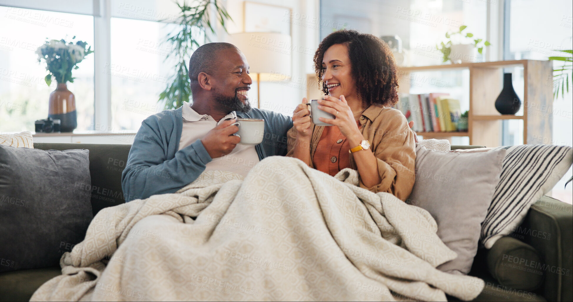 Buy stock photo Bonding, love and coffee with mature couple on sofa for relax, marriage and romance. Happiness, calm and health with people drinking in living room of home for tea, communication and comfort together