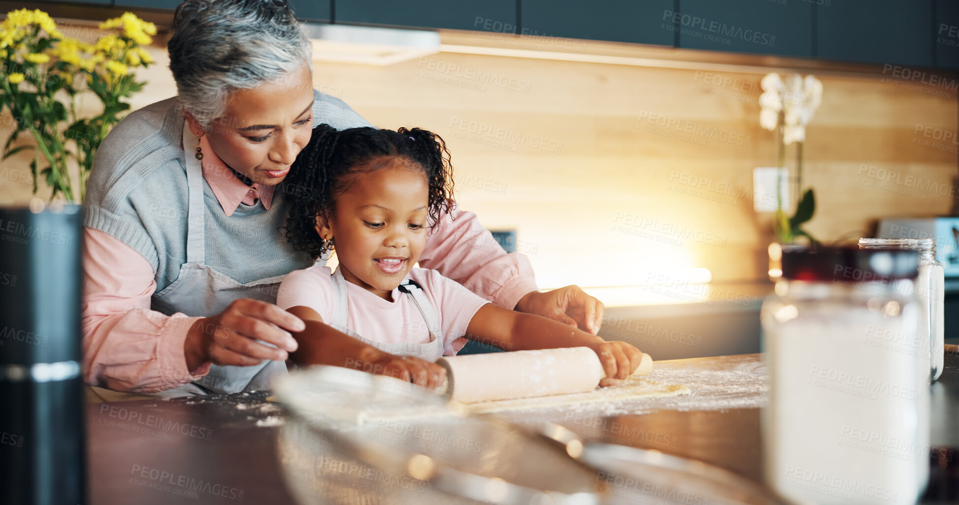 Buy stock photo Grandmother, little girl and baking with roller on table in kitchen for learning, teaching or making dough at home. Happy grandma, child or junior baker preparing dessert, cookies or pastry recipe