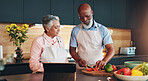 Senior couple, healthy or tablet for cooking recipe method, dinner or guide in home or interracial marriage. Online tutorial, learning or people with ingredients instruction, food or meal prep steps