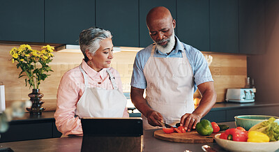 Buy stock photo Senior couple, healthy or tablet for cooking recipe method, dinner or guide in home or interracial marriage. Online tutorial, learning or people with ingredients instruction, food or meal prep steps