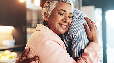 Buy stock photo Home, senior couple and love with hug for connection, security and bonding together in kitchen. Interracial marriage, woman and man with embrace for relationship, commitment and support in house