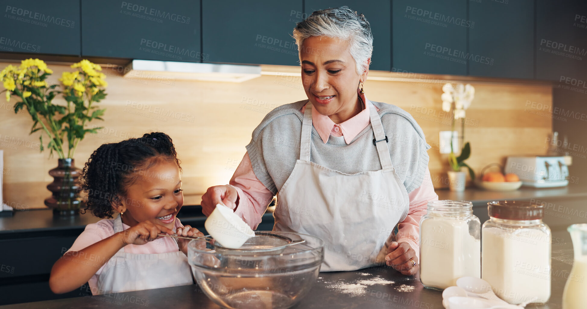 Buy stock photo Baking, child and helping grandmother with preparation for cookies, dessert and childhood development. Flour, baker woman and girl bonding in kitchen with teaching cake recipe, support and education