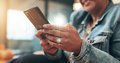 Buy stock photo Communication, woman and hands typing on phone for text message, mobile chat or dating site in home. Person, lens flare and smartphone for social media, online browsing and check email notification