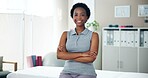 Happy black woman, portrait and physiotherapist with confidence for physical therapy or service at clinic. Young African, female person or orthopedic with smile or arms crossed for medical help