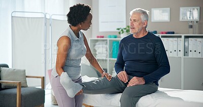 Buy stock photo Physiotherapy, leg pain and senior man with chiropractor for wellness, health and mobility. Healthcare, clinic and person with mature patient for physical therapy, rehabilitation and medical support