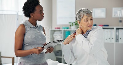 Buy stock photo Women, physiotherapist and clipboard with patient for shoulder pain, injury or medical consultation at clinic. Female person, orthopedic and senior client with sore muscle tension at private practice