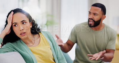 Buy stock photo Angry, affair and couple with argument on sofa in living room for divorce, cheating or breakup. Marriage, communication and young man and woman fighting for infidelity in relationship at home.