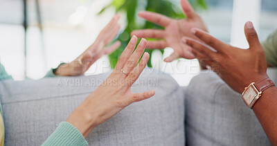 Buy stock photo People, hands and gesture with argument by sofa for miscommunication, conflict and discussion. Conversation, frustrated and fight in living room at home for issue disagreement, dispute and problem