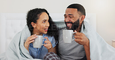 Buy stock photo Couple, happy and coffee on bed in home with blanket, relax and connection with love in morning. Man, woman and drink with tea cup bedroom with memory, conversation and laugh with joke in apartment