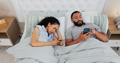 Buy stock photo Couple, smartphone and conflict in bed, ignore and annoyed with reading, chat or social media addiction in home. Man, woman and doom scrolling with anger, fight or frustrated on mobile app with phone