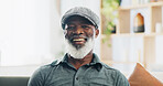 Senior man, portrait and retirement in house for relax, peace and positive mood on weekend on sofa. Black person, face and happy in living room on couch for comfort, optimistic or rest with wellbeing