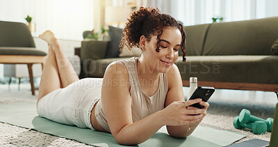 Buy stock photo Smile, home and woman with smartphone, yoga and search on social media, online and relax in lounge. Fitness, digital and routine for wellness, app and mobile for tips, pilates and healthy in house